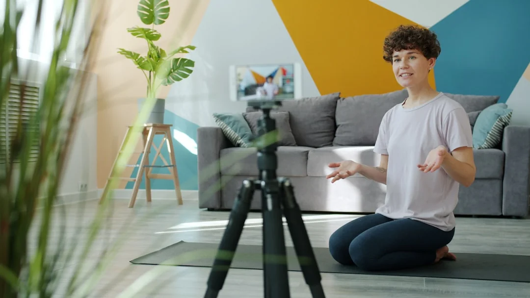 Three businesswomen collaborate with graphs and a laptop in a modern office setting.